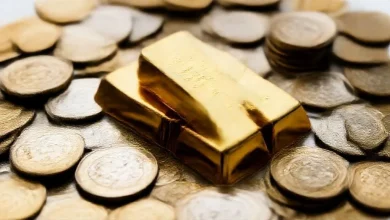 gold bars coins stack